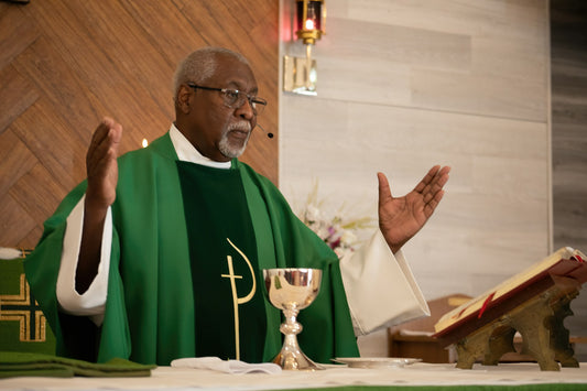 African American priest delivering a sermon. Photo by Dawn McDonald.